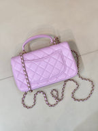 Quilted light purple mini handbag angled view with chain strap and front flap