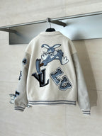 Louis Vuitton cream varsity-style jacket with blue cartoon and letter graphic on back