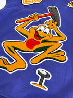 Blue long-sleeve sweatshirt with large illustrated graphic patches and applique details