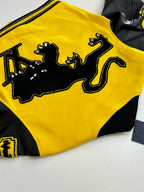 Louis Vuitton yellow and black varsity jacket side view with large graphic panel and rib trim