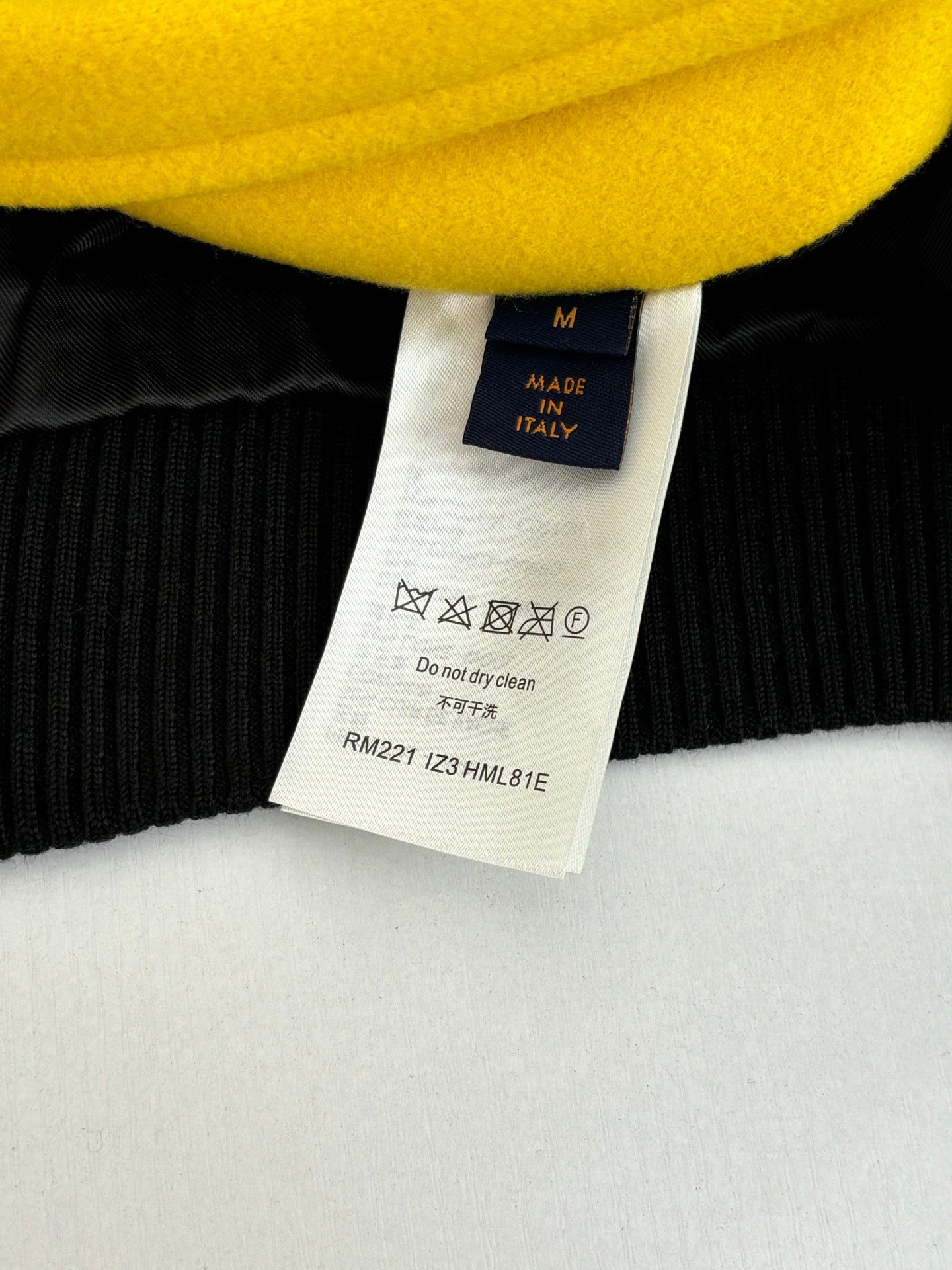 Black ribbed knit with yellow collar label marked M, Made in Italy