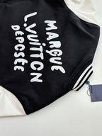 Louis Vuitton varsity jacket back, black with white vertical text graphic.