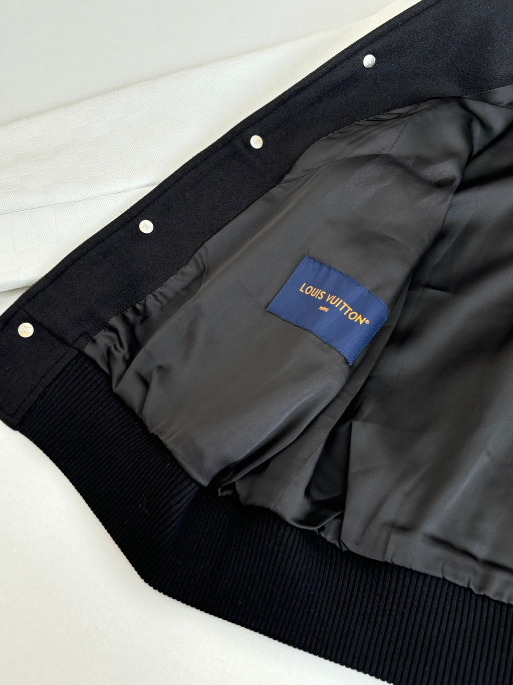 Dark long jacket with snap buttons and Louis Vuitton lining label