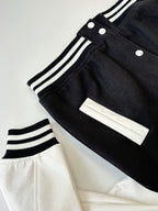 Louis Vuitton varsity jacket cuff detail, ribbed stripes, snap buttons and white panel.