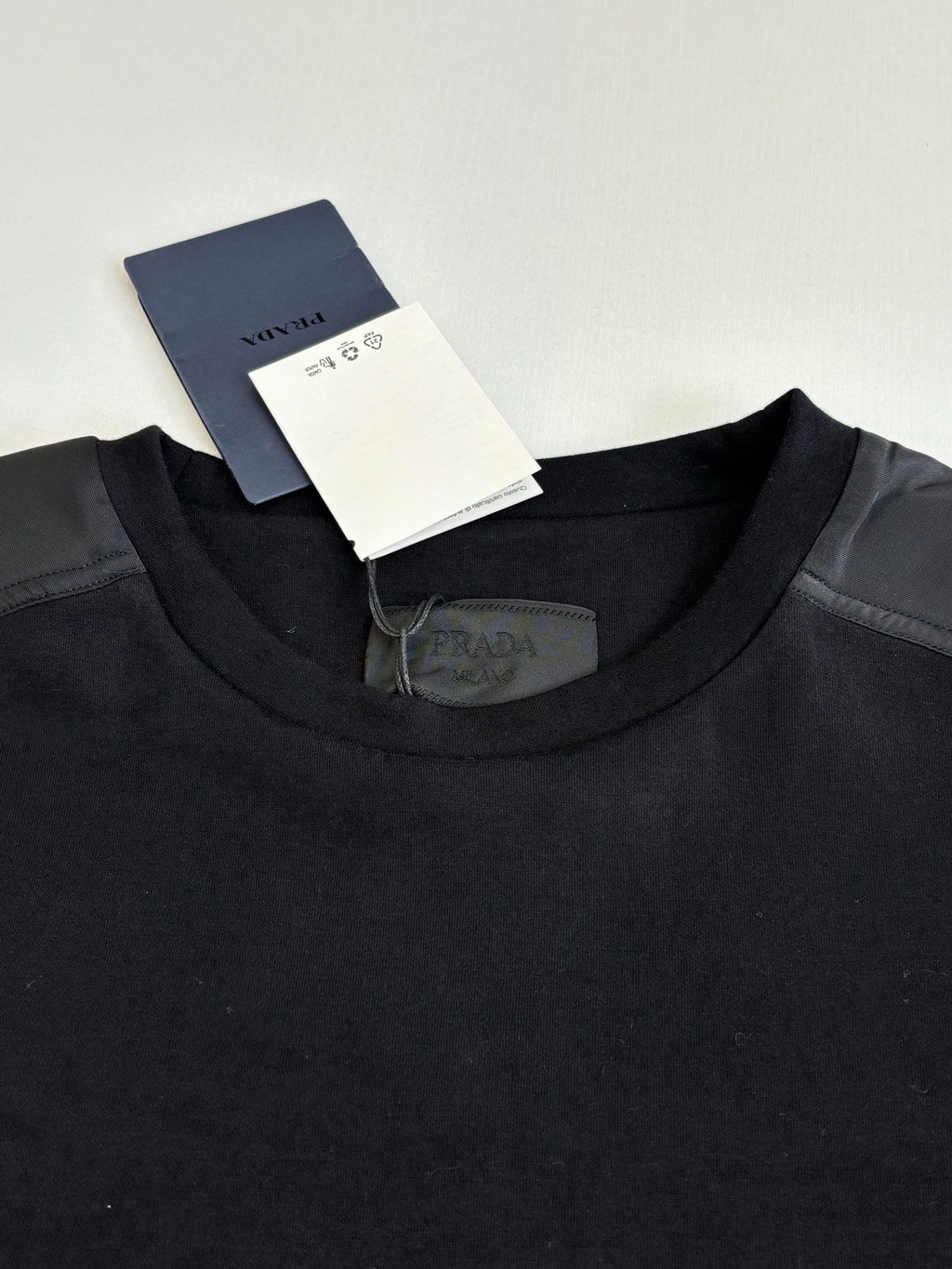 Prada crewneck sweatshirt collar with care tag, dark navy