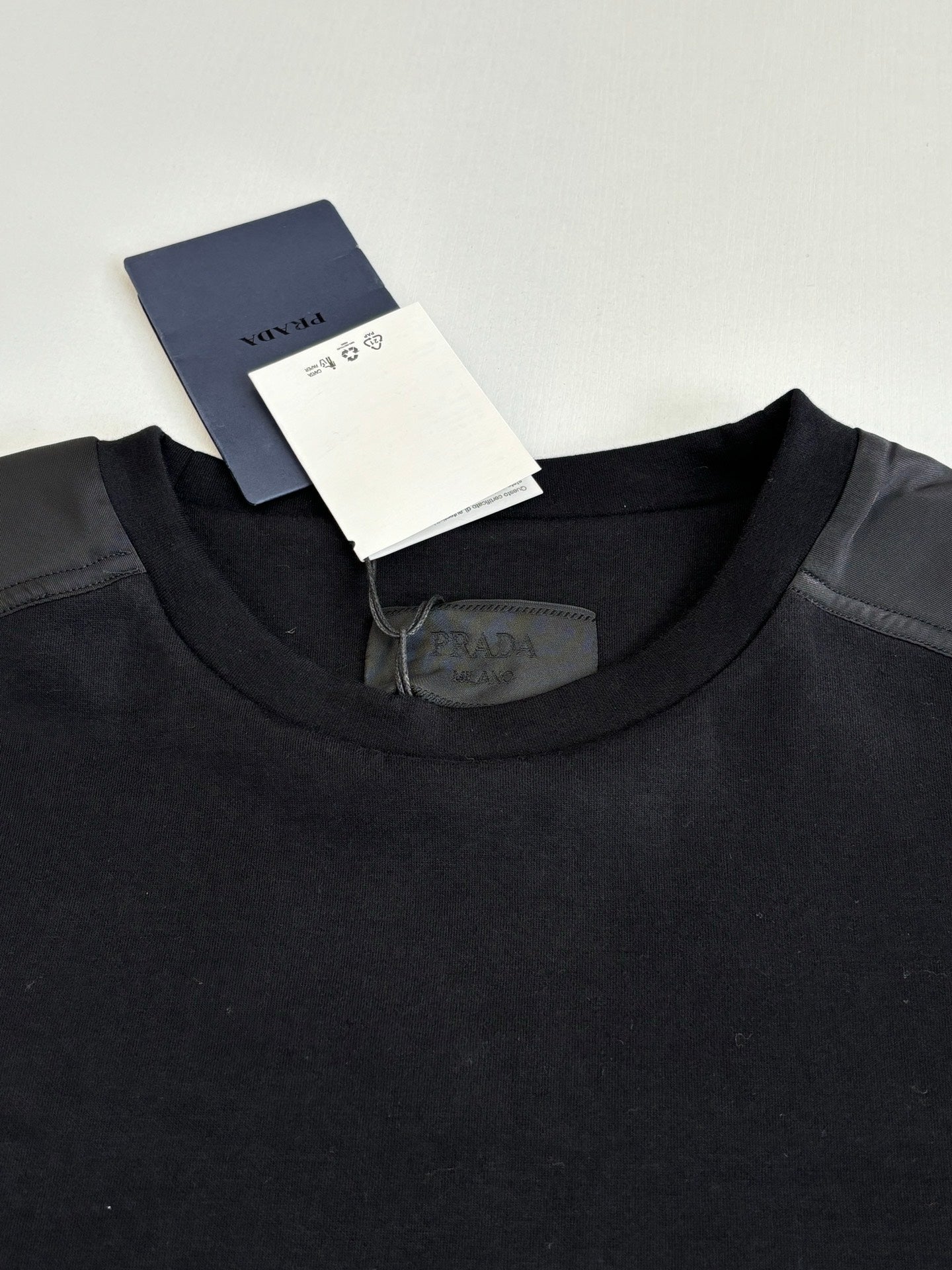 Prada crewneck sweatshirt collar with care tag, dark navy