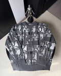 Gray knit sweater with long sleeves and all-over black-and-white logo pattern
