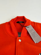 Orange ribbed collar varsity jacket with button placket, inner tags under collar