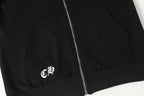 Black hoodie lower front zipper and hem with small white logo mark.
