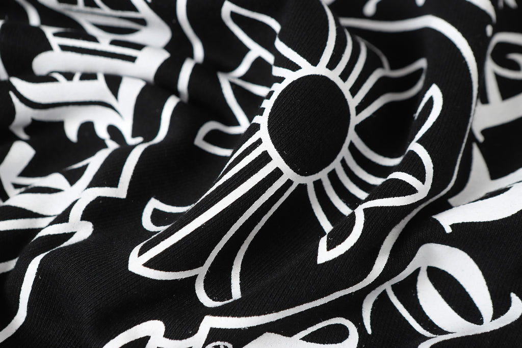 Black long-sleeve top with white floral graphic print