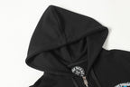 Black zip-up hoodie hood with drawstring and metal zipper pull detail.