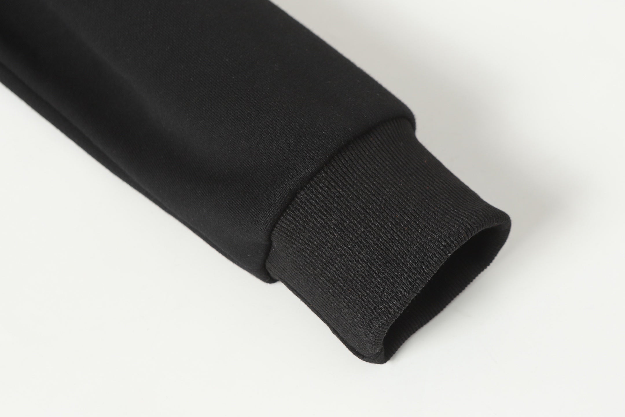 Black long-sleeve top sleeve hem with ribbed cuff
