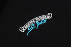 Black hoodie chest logo patch in white and blue, stitched look.