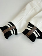 Louis Vuitton knit cuff details, black-and-white striped rib with monogram band