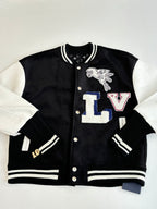 Louis Vuitton varsity jacket front with black body, striped trim, and large LV and animal graphic