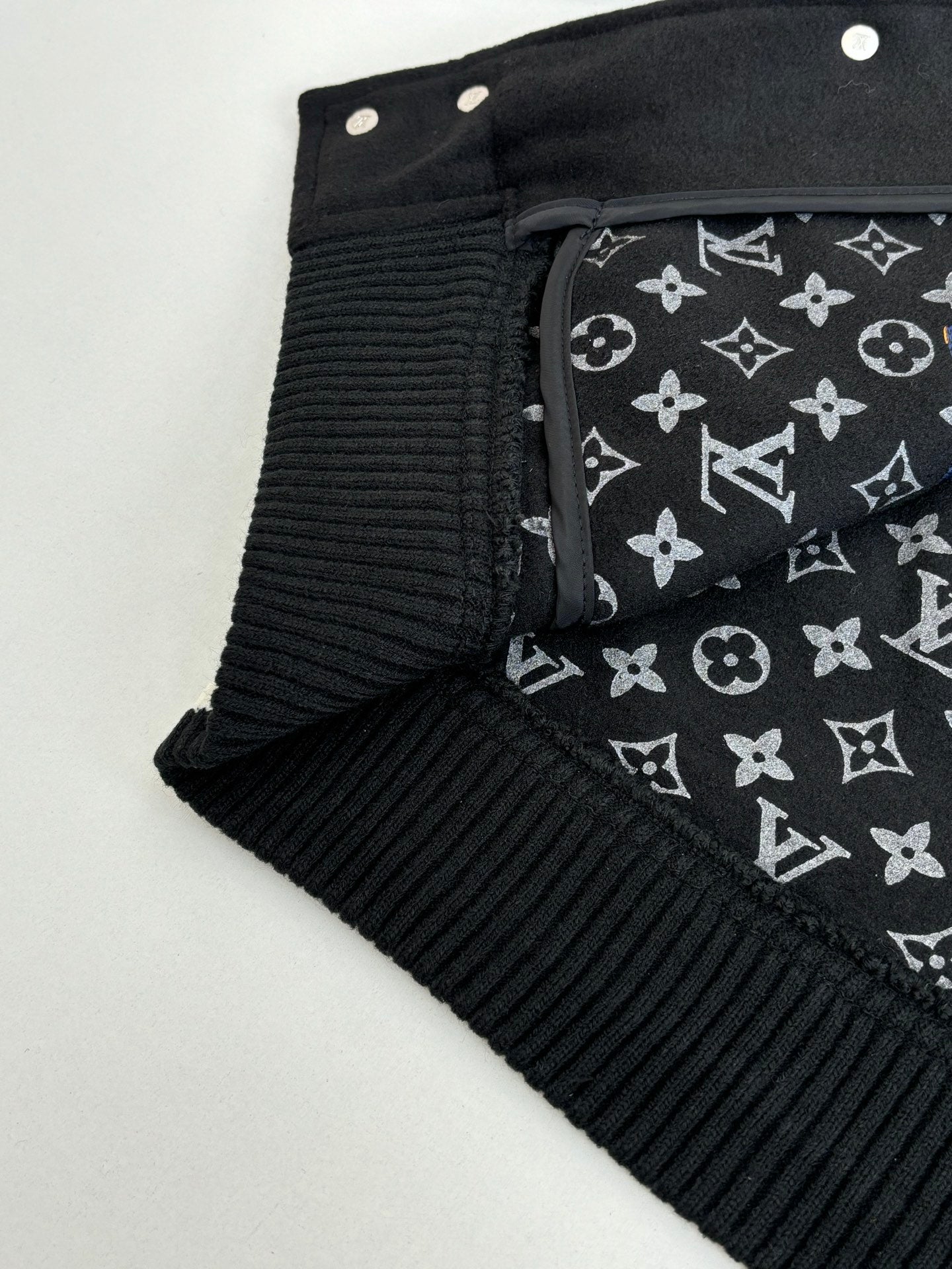 Louis Vuitton varsity jacket cuff and collar with black lining featuring repeating monogram pattern