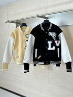 Louis Vuitton varsity jacket set on hangers: black and white style, plus beige contrasting jacket