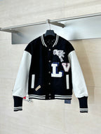 Louis Vuitton varsity jacket with black body, white sleeves, snap buttons, striped cuffs