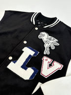 Louis Vuitton varsity jacket close-up with colorful LV letter graphic and bird emblem