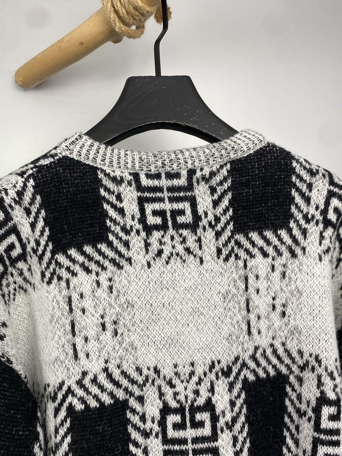 Givenchy knit sweater neckline and shoulders with black-and-white geometric motif