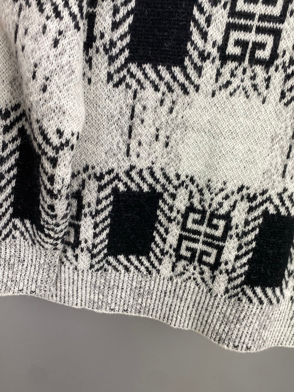 Givenchy knit sweater midsection with black-and-white geometric squares pattern