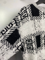 Givenchy knit sweater sleeve and shoulder with black-and-white geometric knit pattern