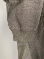 Grey knit sweater sleeve and ribbed hem cuff, logo pattern detail