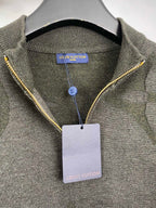 Grey knit sweater with yellow-trim zipper and interior neckline label, hanging tag