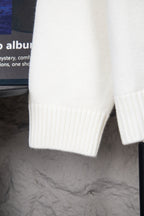 White knit sweater cuff and sleeve hem with ribbed knit detailing