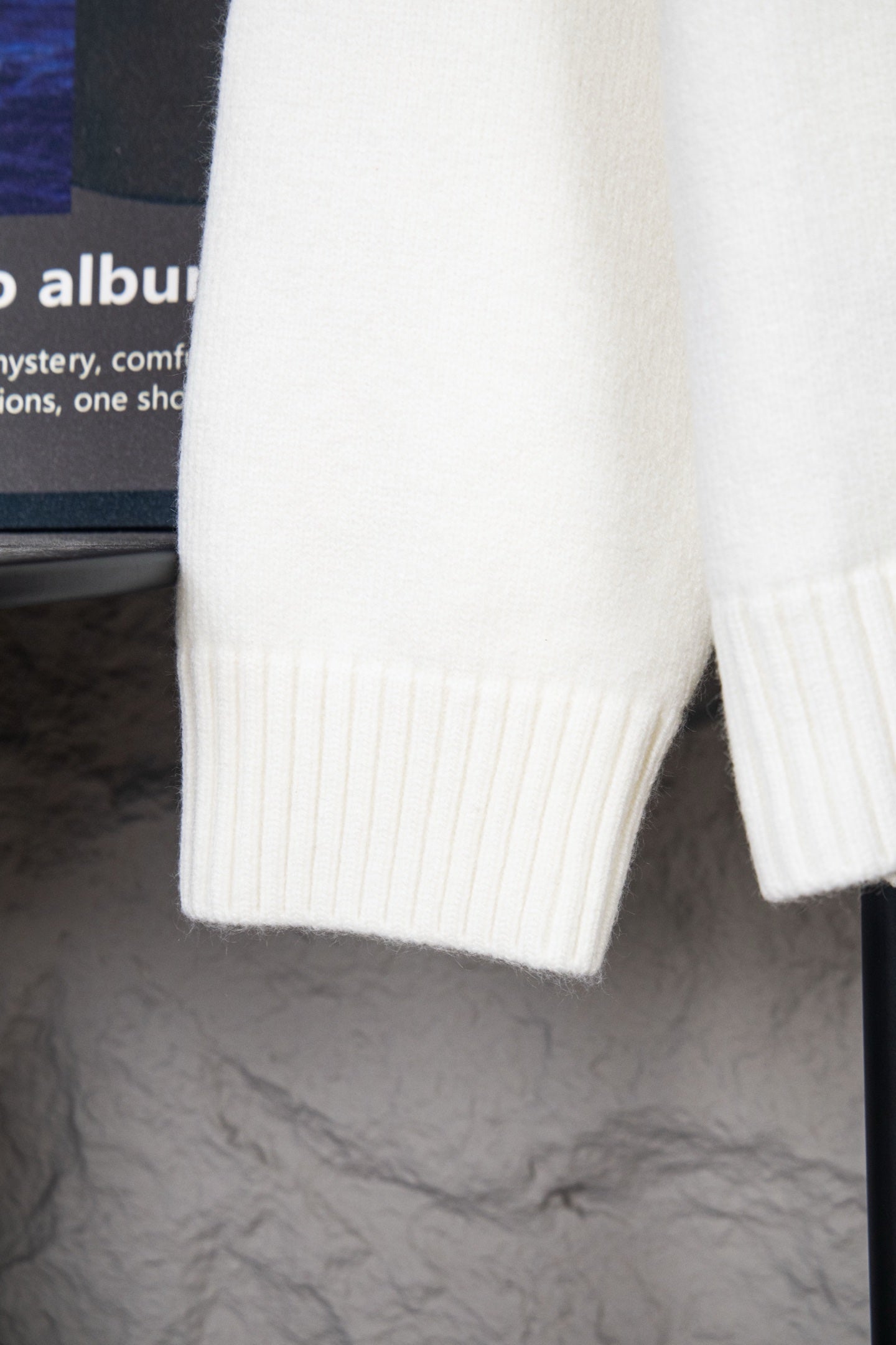 White knit sweater cuff and sleeve hem with ribbed knit detailing