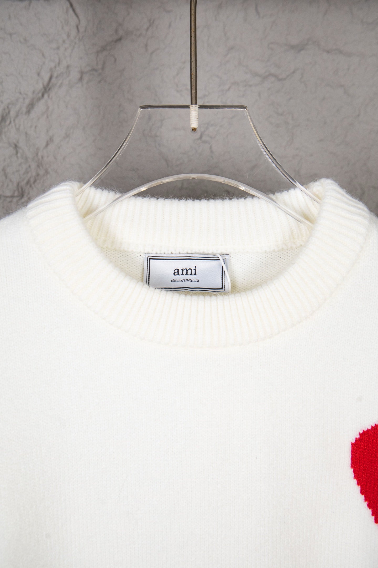 White ribbed crew-neck knit sweater with ami label at inner collar
