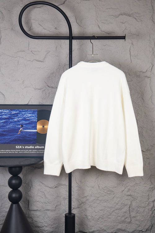 White knit sweater, back view, ribbed crew neck and long sleeves