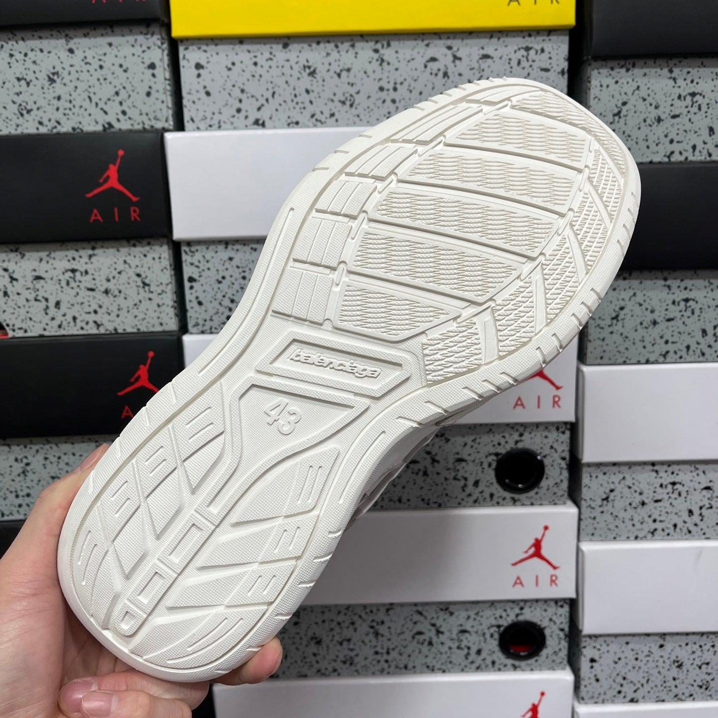 White sneaker outsole with molded traction tread pattern