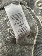 Hang tag on knit sweater with care and size text