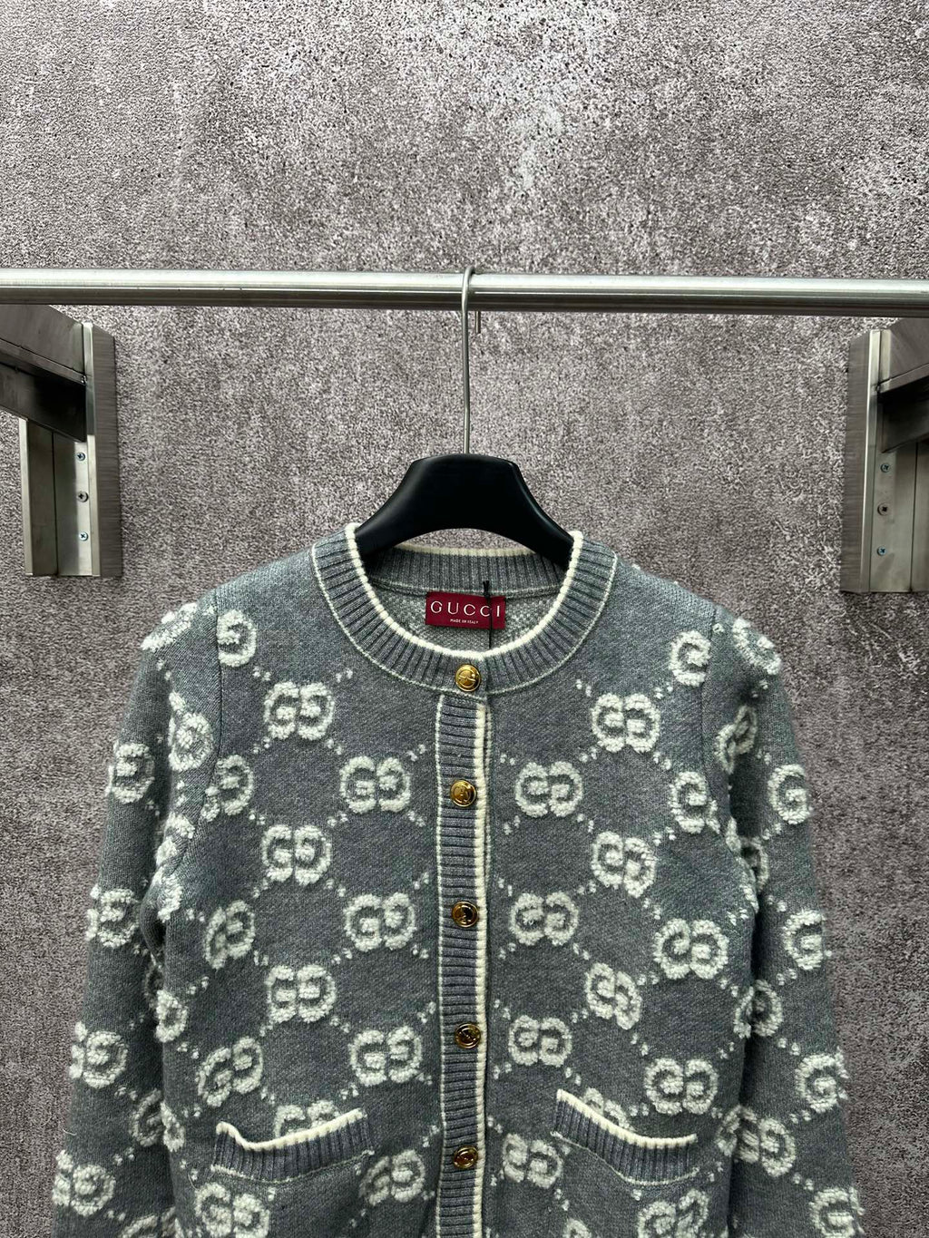 Gucci dark green knit cardigan with GG logo pattern, round ribbed collar, gold button placket.
