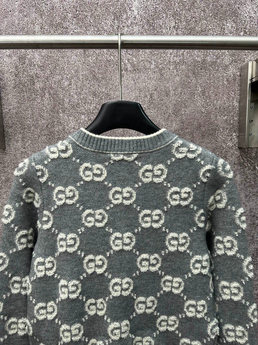 Dark green GG monogram knit cardigan back view with ribbed collar