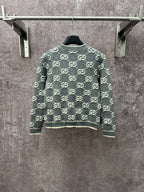 Dark green GG monogram knit cardigan with crew neck and ribbed cuffs