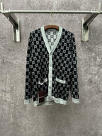 Gucci long-sleeve V-neck top with black GG monogram and light gray trim