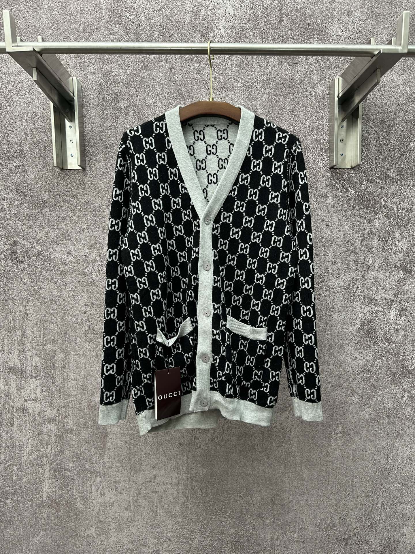 Gucci long-sleeve V-neck top with black GG monogram and light gray trim