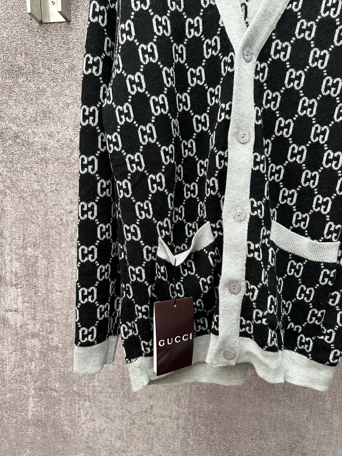 Gucci long-sleeve sweater, black with GG monogram print and light gray cuffs
