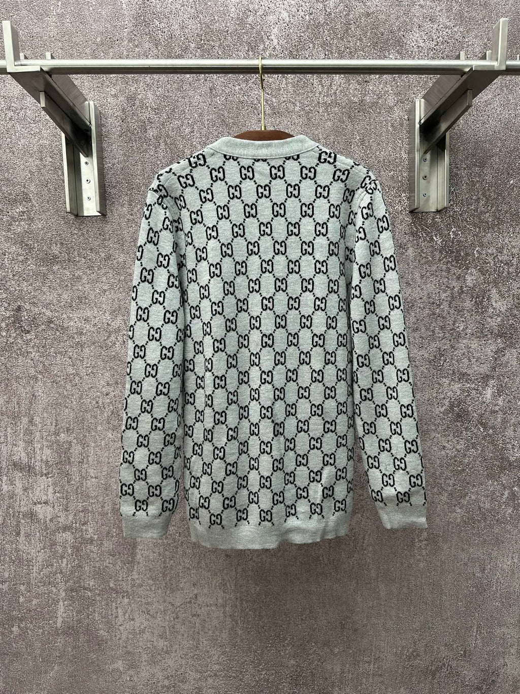 Gucci long-sleeve crewneck top with light gray base and black GG monogram print