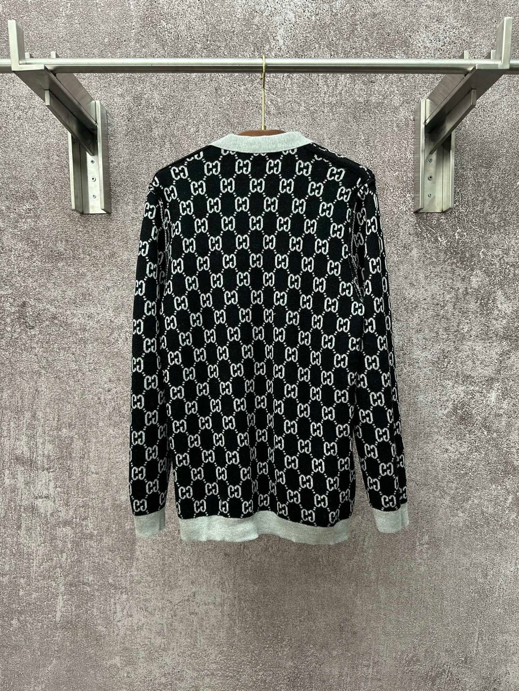 Gucci long-sleeve crewneck top with black GG monogram and light gray hem