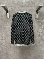 Gucci long-sleeve crewneck top with black GG monogram and light gray hem