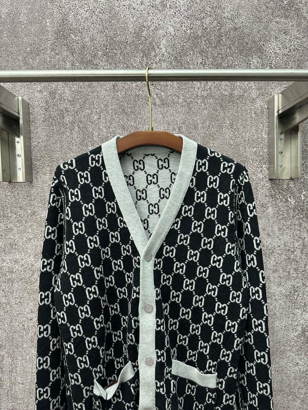 Gucci long-sleeve sweater on hanger, black GG monogram pattern with gray trim