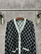Gucci long-sleeve sweater on hanger, black GG monogram pattern with gray trim