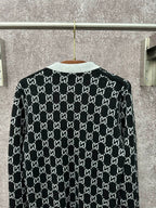 Gucci long-sleeve sweater, black GG monogram with gray ribbed collar and cuffs