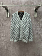 Gucci long-sleeve V-neck top with gray and black GG monogram pattern