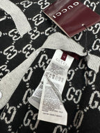 Gucci knit sweater neckline and label, black GG pattern with gray ribbing
