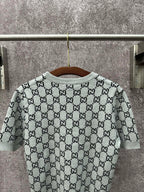 Light gray knit T-shirt with allover black GG logo pattern and crew neck