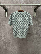 Light gray knit T-shirt with allover black GG logo pattern and short sleeves